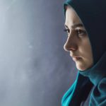 sad-muslim-girl-hijab-black-background_8119-1017